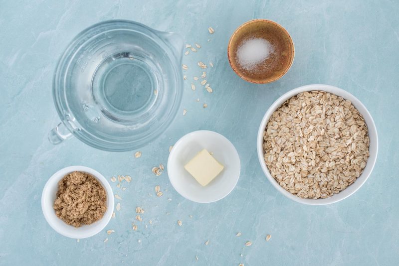 Ingredients for Instant Pot oatmeals, including rolled oats, salt, butter, brown sugar, and water.