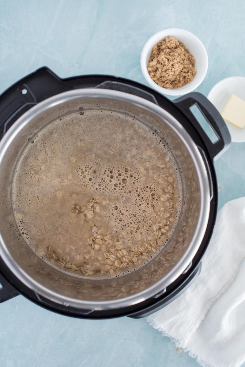 An overhead picture of ingredients added to an Instant Pot for making oatmeal.