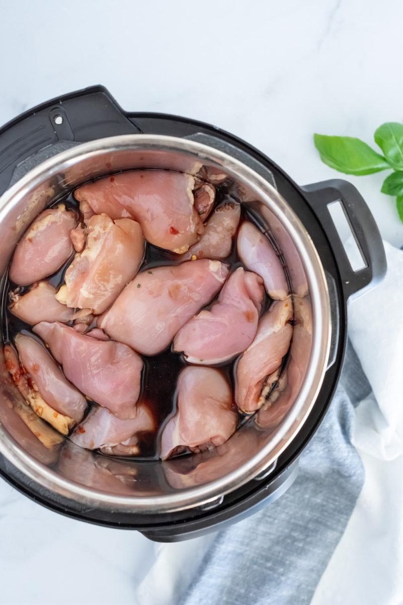Overhead picture of chicken thighs in an Instant Pot for making honey garlic chicken.