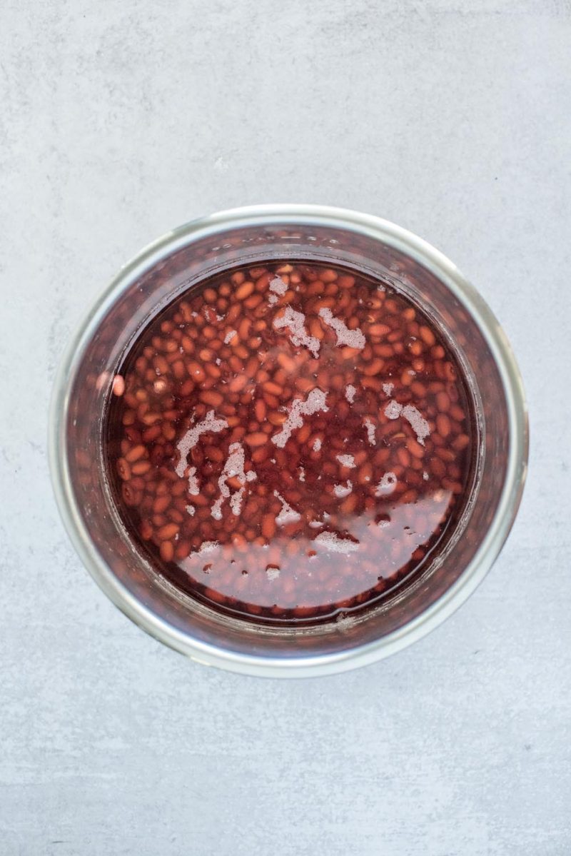 Soaking dried kidney beans in an Instant Pot inner pot.