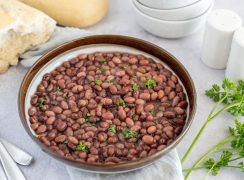 Picture of a bowl of Instant Pot kidney beans, topped with fresh parsley