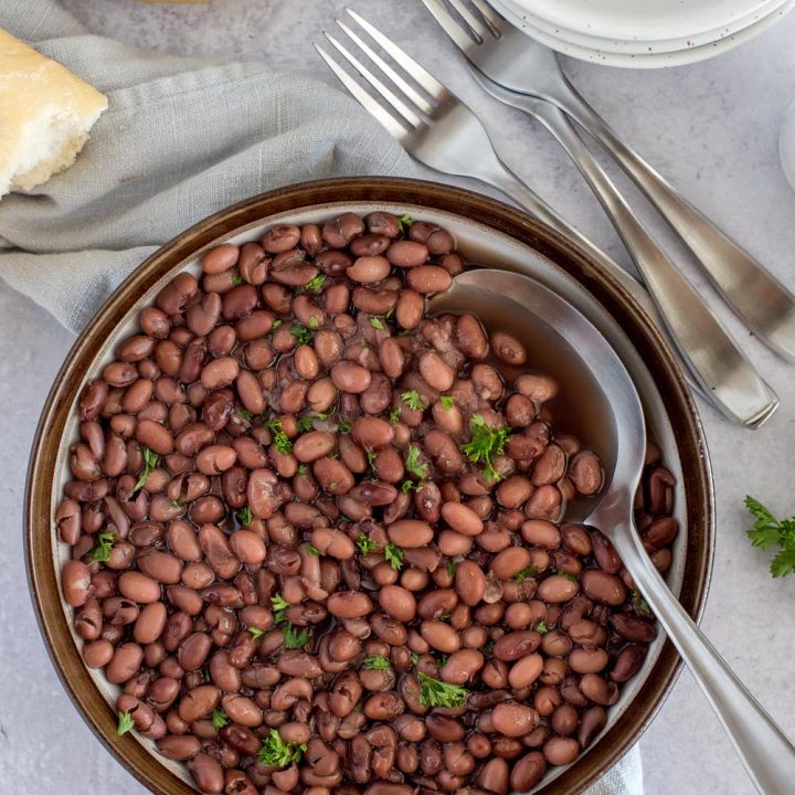 Overhead picture of a bowl of Instant Pot kidney beans, topped with fresh parsley