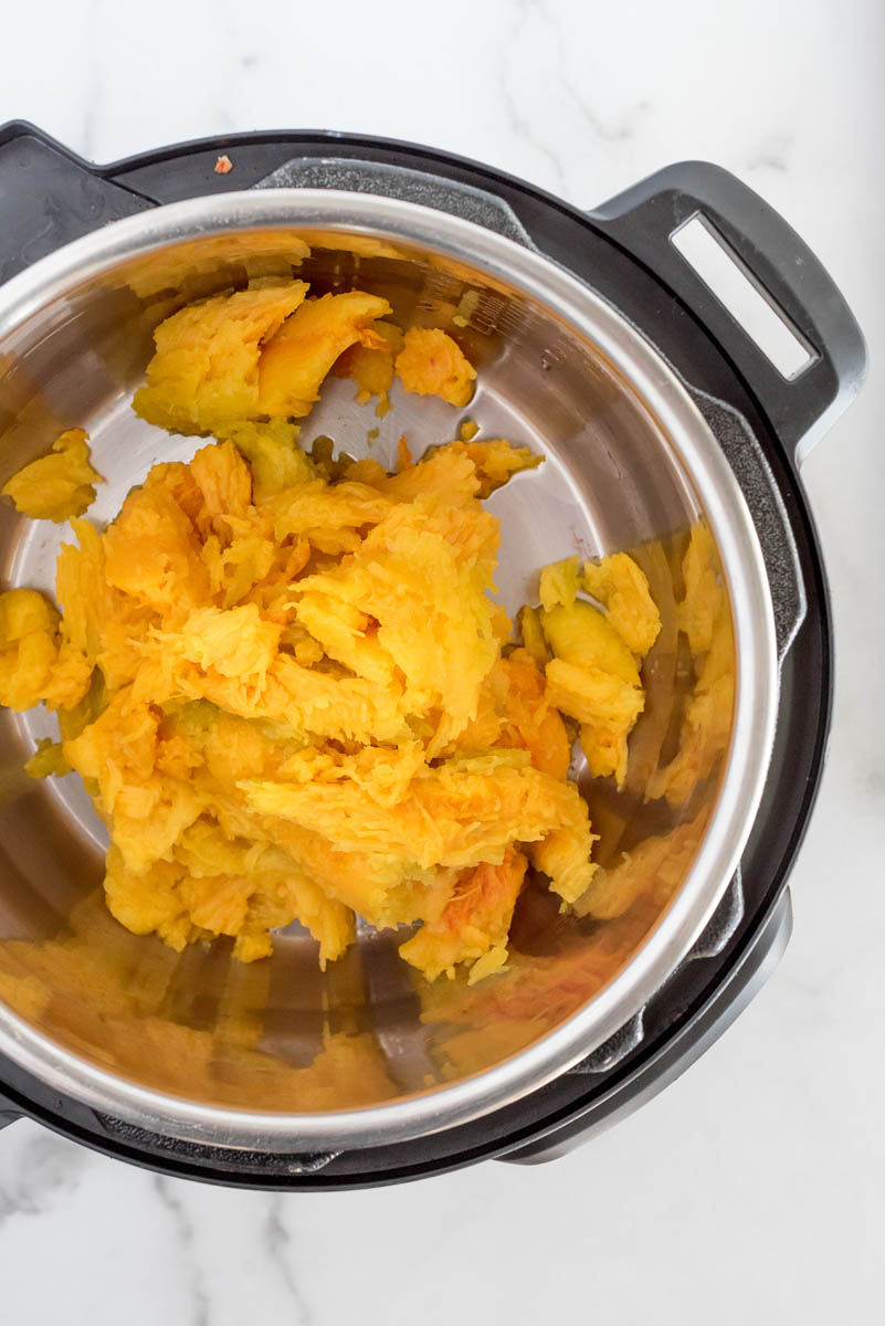 Cooked pumpkin added back to an Instant Pot and ready to puree.