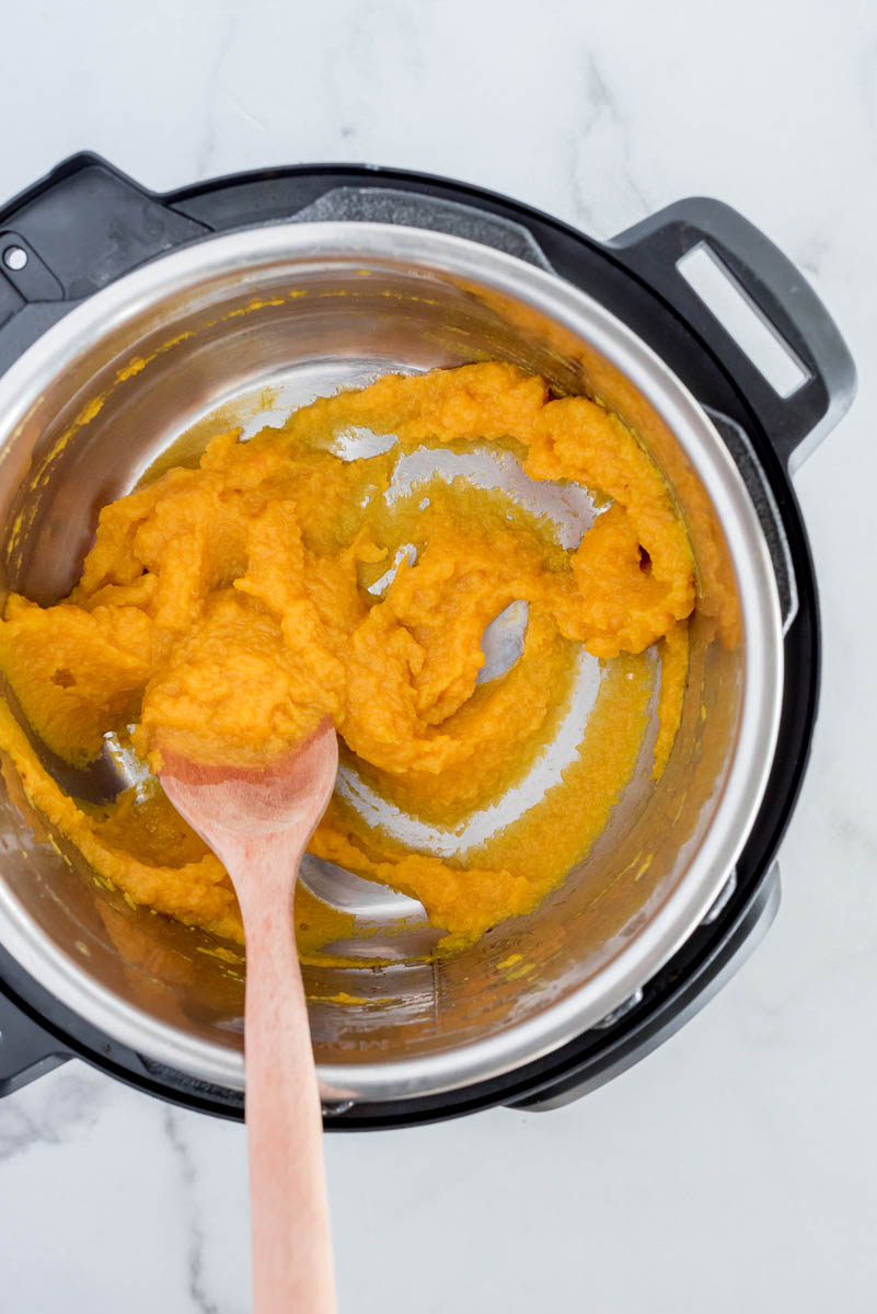 Overhead shot of pumpkin puree that has been sauted and cooked down in an Instant Pot.