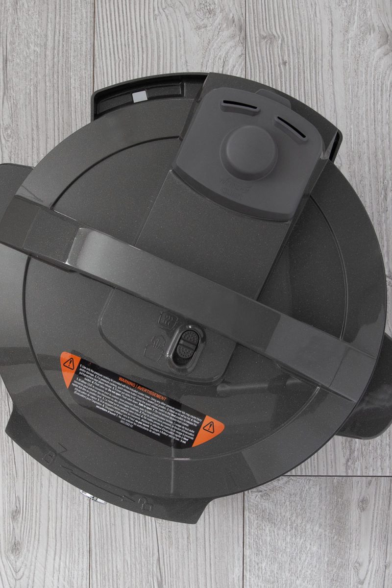 Overhead picture of the Instant Pot Rio Wide Plus with a slide button release and a whisper quiet cover for the steam release.