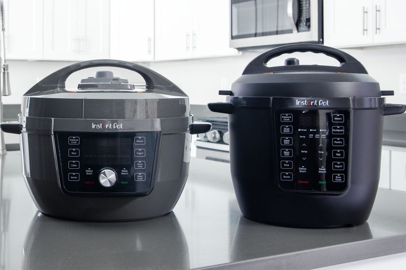 The Instant Pot Rio Wide Plus with a gray plastic exterior next to a 6qt Instant Pot Rio with a black plastic exterior.