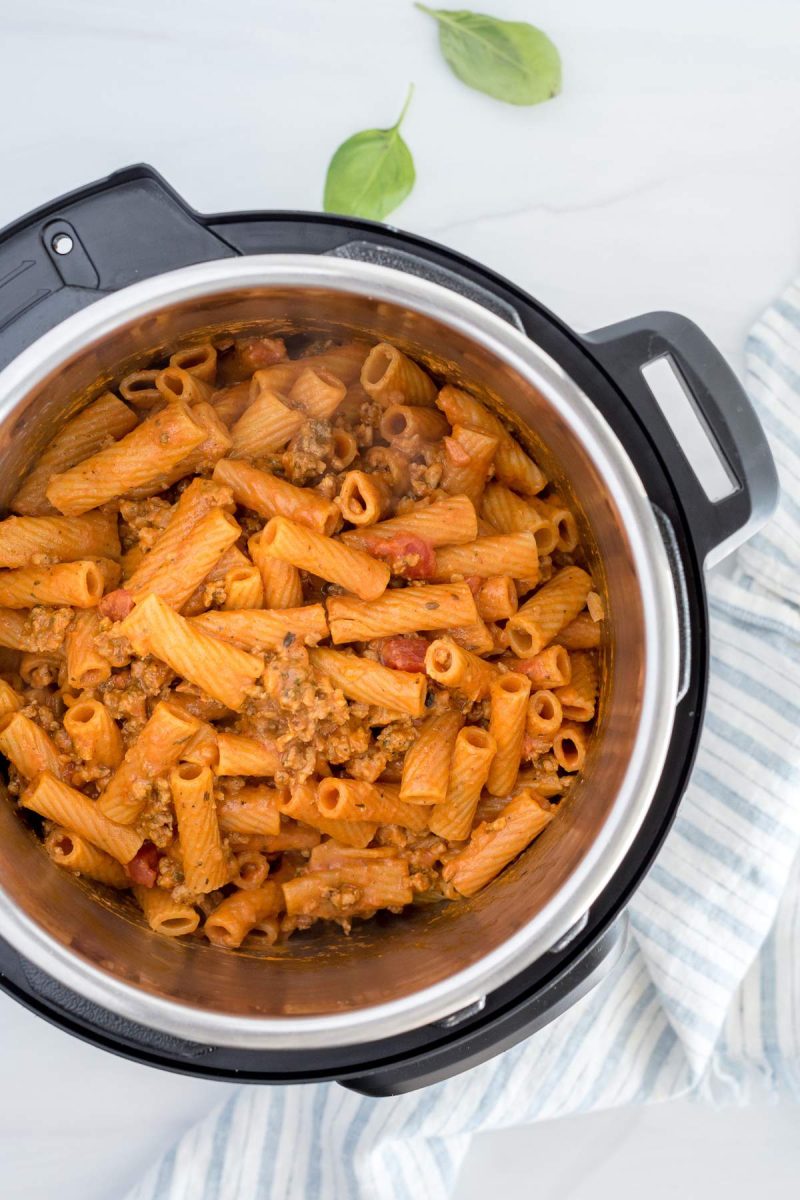 Overhead picture of the Instant Pot with rigatoni and sausage cooked and ready to serve.